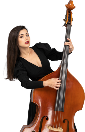 Close-up of a young woman in black dress playing her double-bass