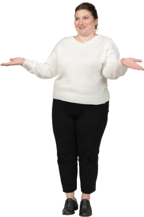 Front view of a happy plump woman in casual clothes gesturing
