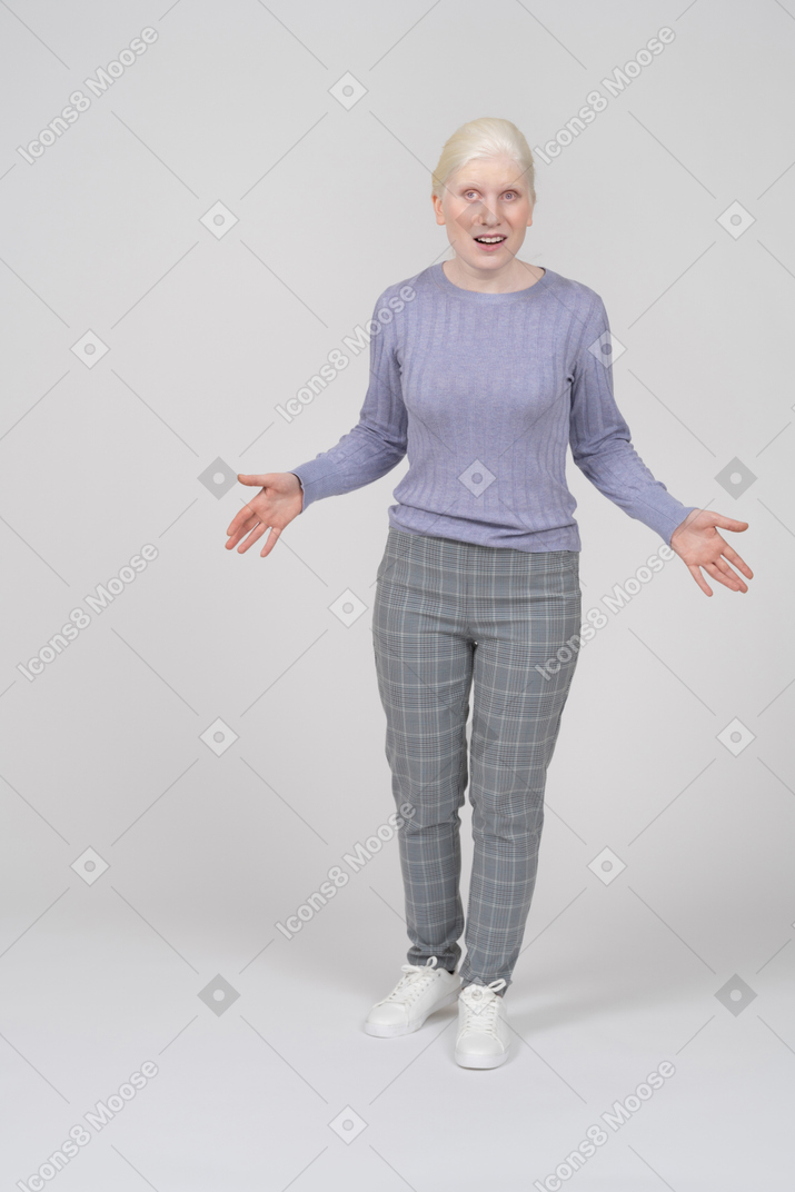 Young woman spreading arms and explaining something