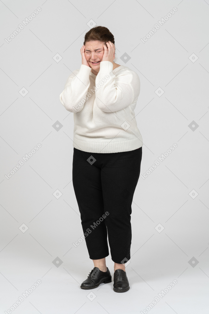 Plump woman suffering from a terrible headache