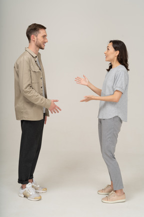 Side view of young couple speaking to each other