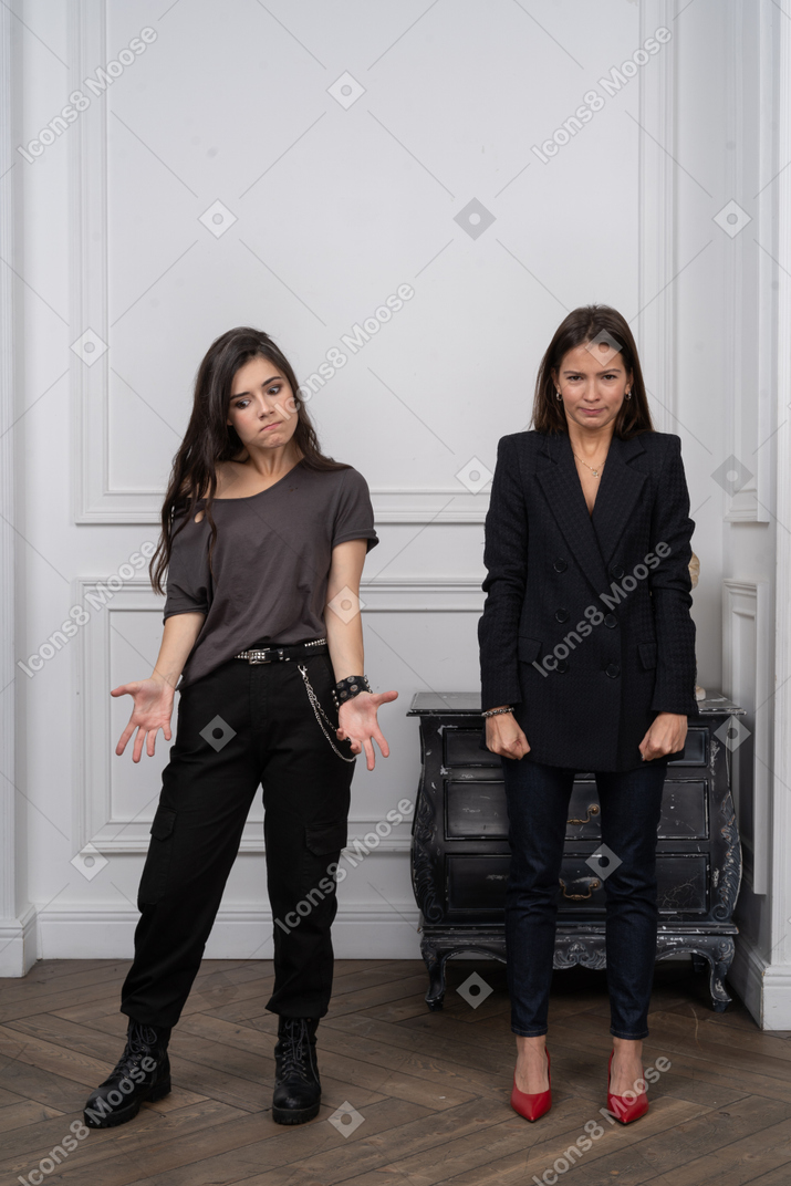 Two annoyed young women in the room