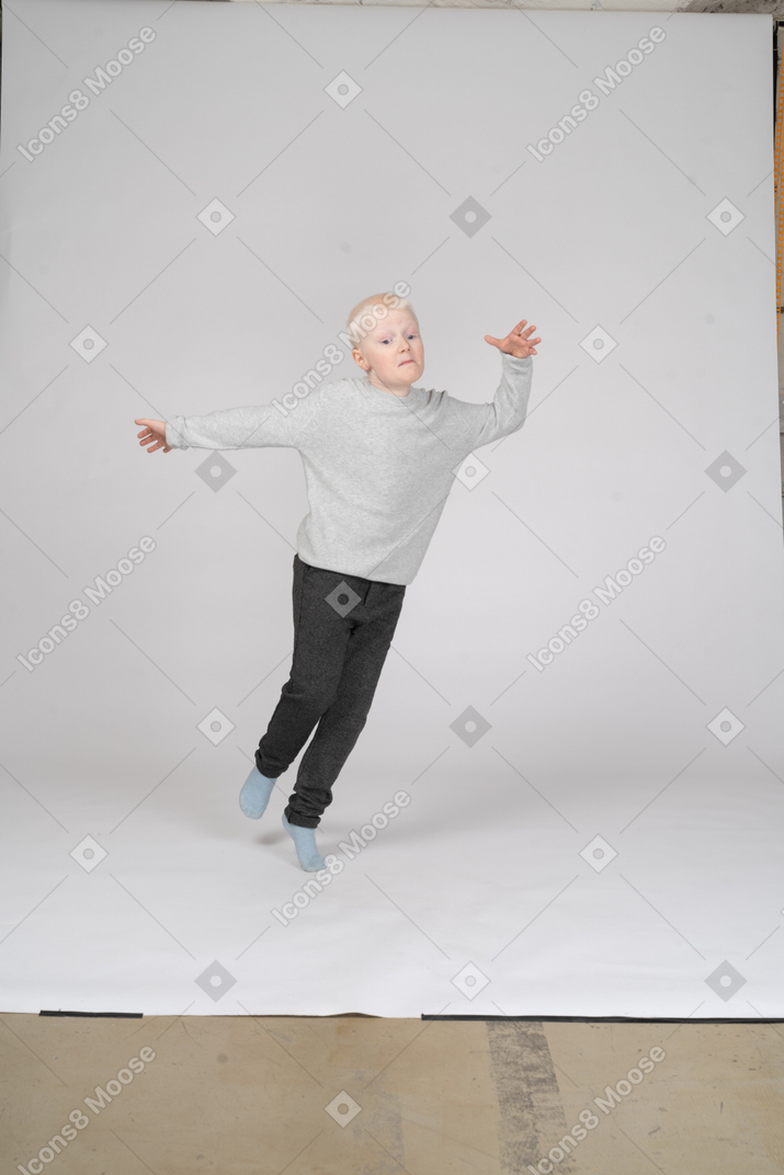 Energetic little boy jumping around