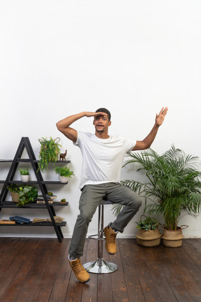 Good looking young man sitting on a chair