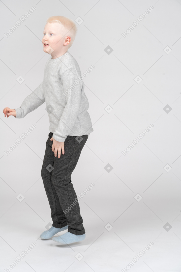 Three-quarter view of a boy jumping