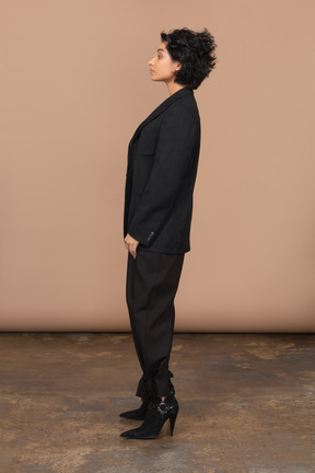 Side view of a businesswoman dressed in black suit