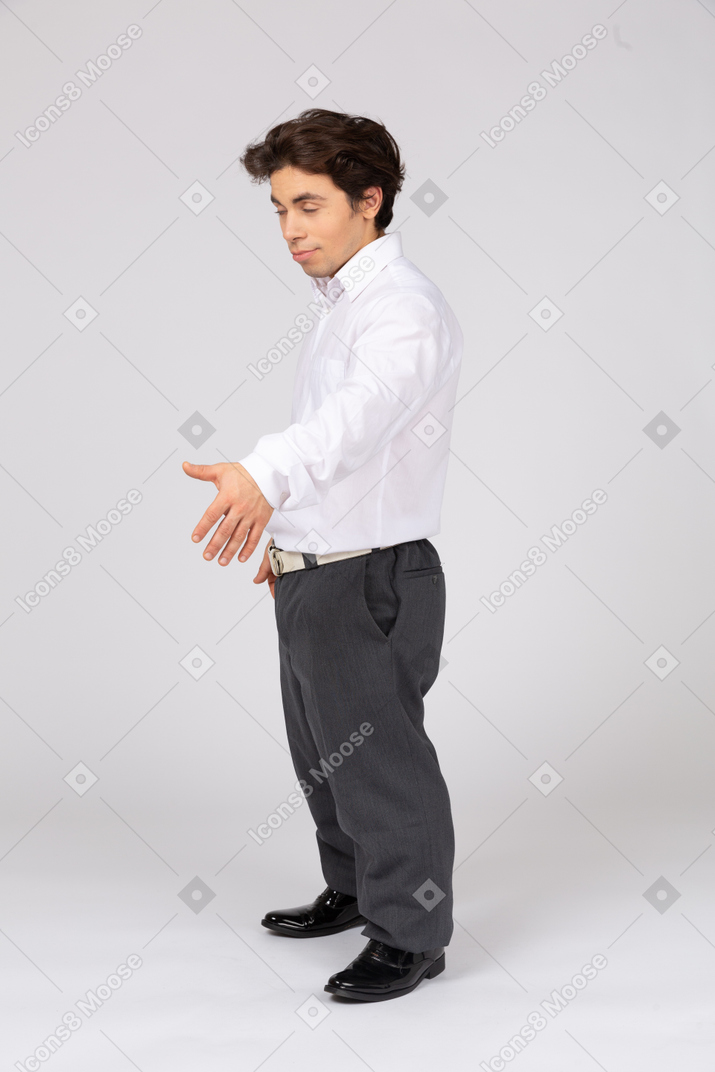 Employee with closed eyes holding out his hand for handshake