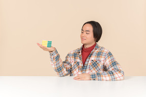 An asian geek guy in a checkered shirt