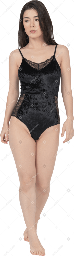 Full length portrait of a serious female in black velvet bodysuit
