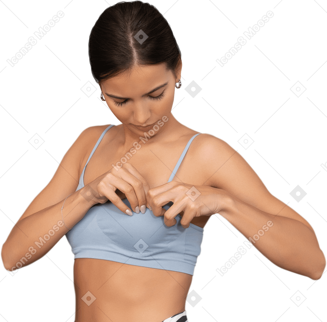 Close-up a woman correcting her sports bra