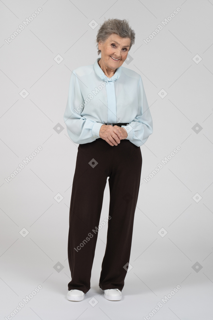 Front view of an old woman smiling flirtatiously