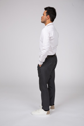 A man in a white shirt and black pants