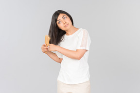 Young indian woman brushing her hair