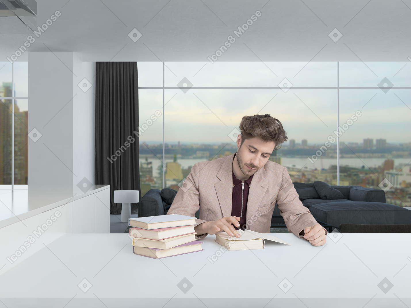 Handsome young man in a beige jacket sitting at the table in a spacious modern room while reading books