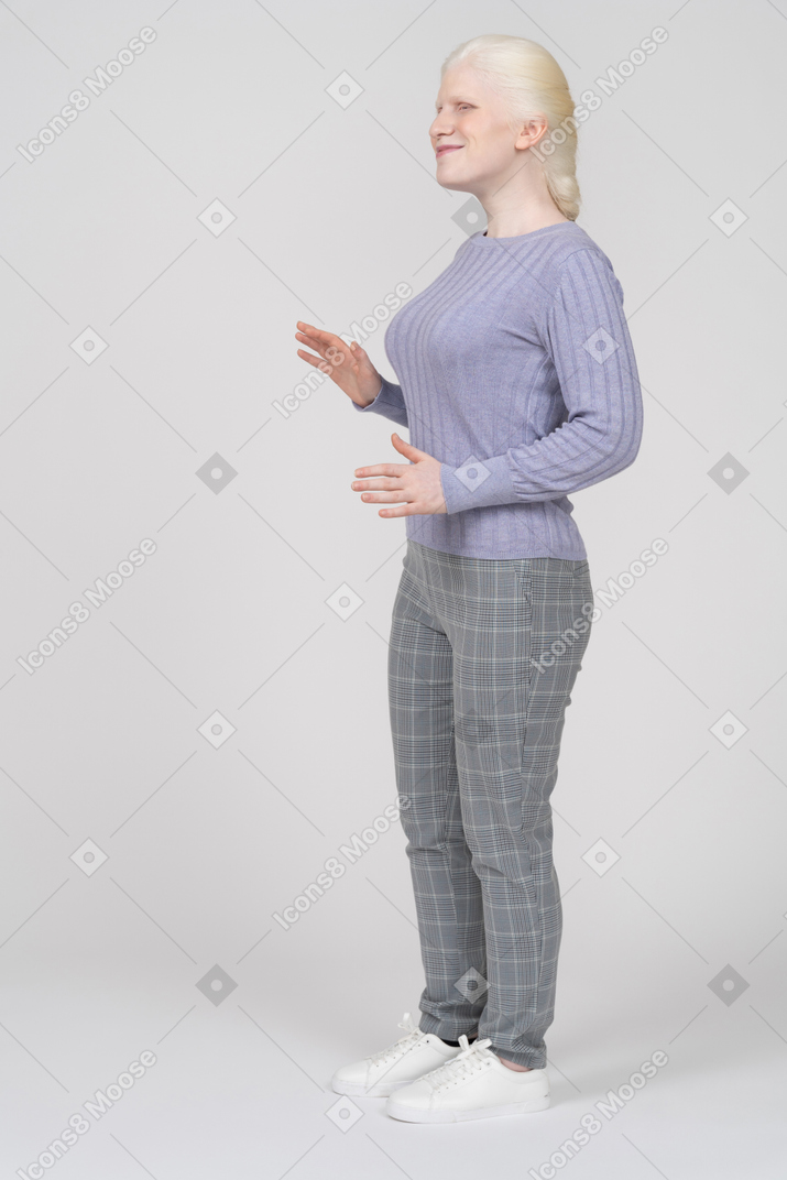 Girl standing with bent arms