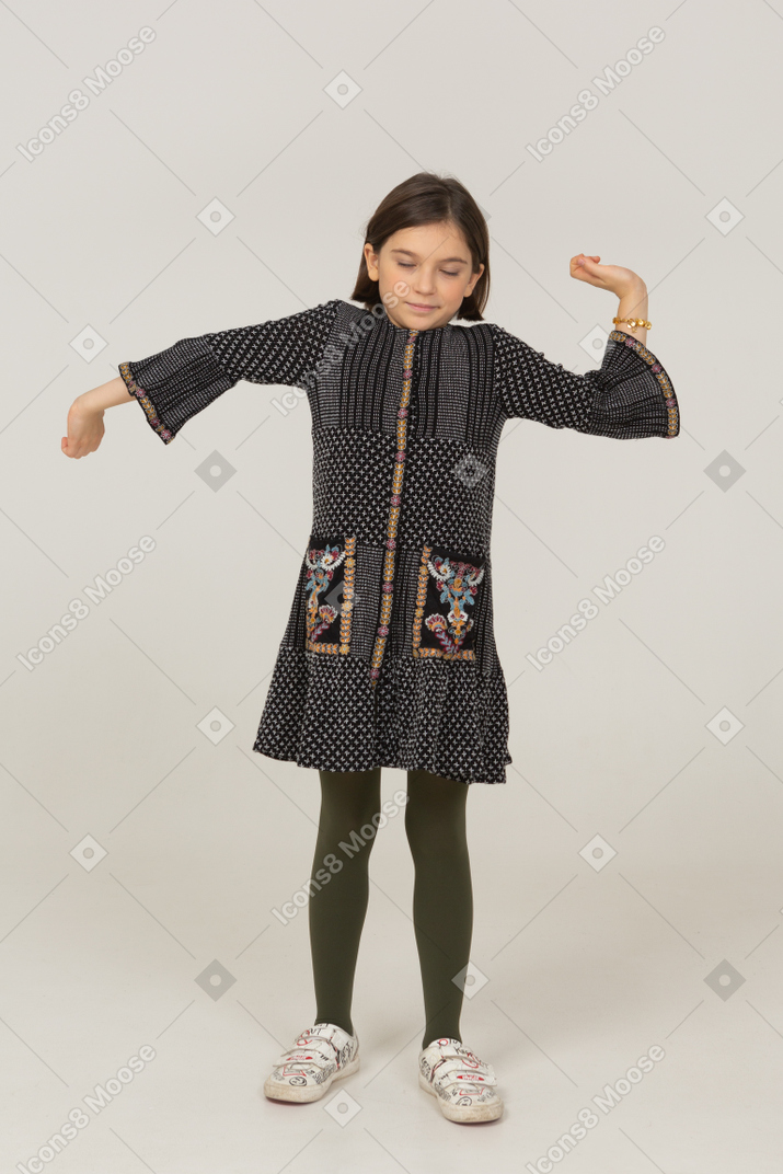 Front view of a tired little girl in dress outspreading arms