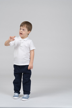 Front view of little boy talking