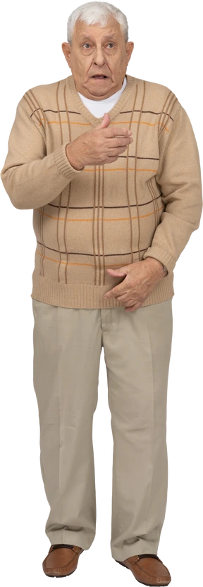 Front view of a scared old man in casual clothes