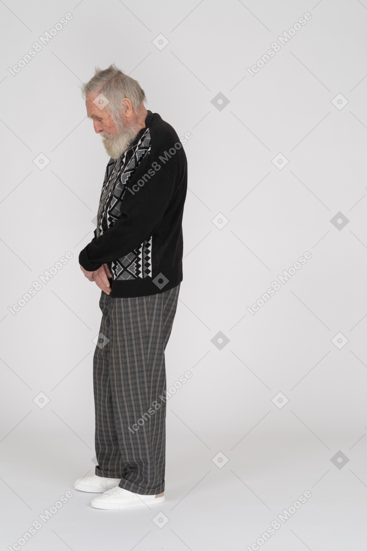 Side view of ashamed elderly man looking down