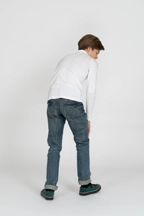 Young man in casual clothes standing