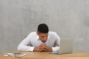 Young man looking at screen