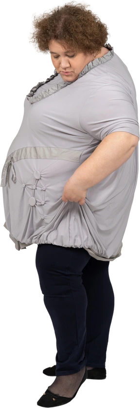 Side view of a woman lifting the dress