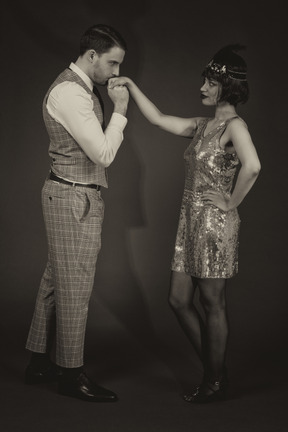 Gentleman kissing lady`s hand