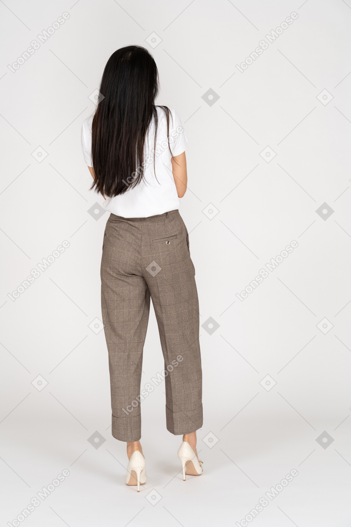 Back view of a young woman in breeches