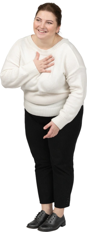 Front view of a happy plump woman in casual clothes
