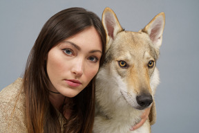 Close-up of a female master with her dog