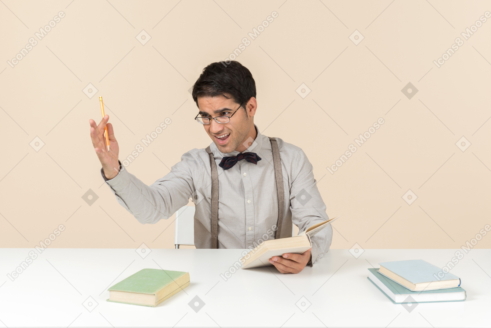 Professor sitting at the table and reading books