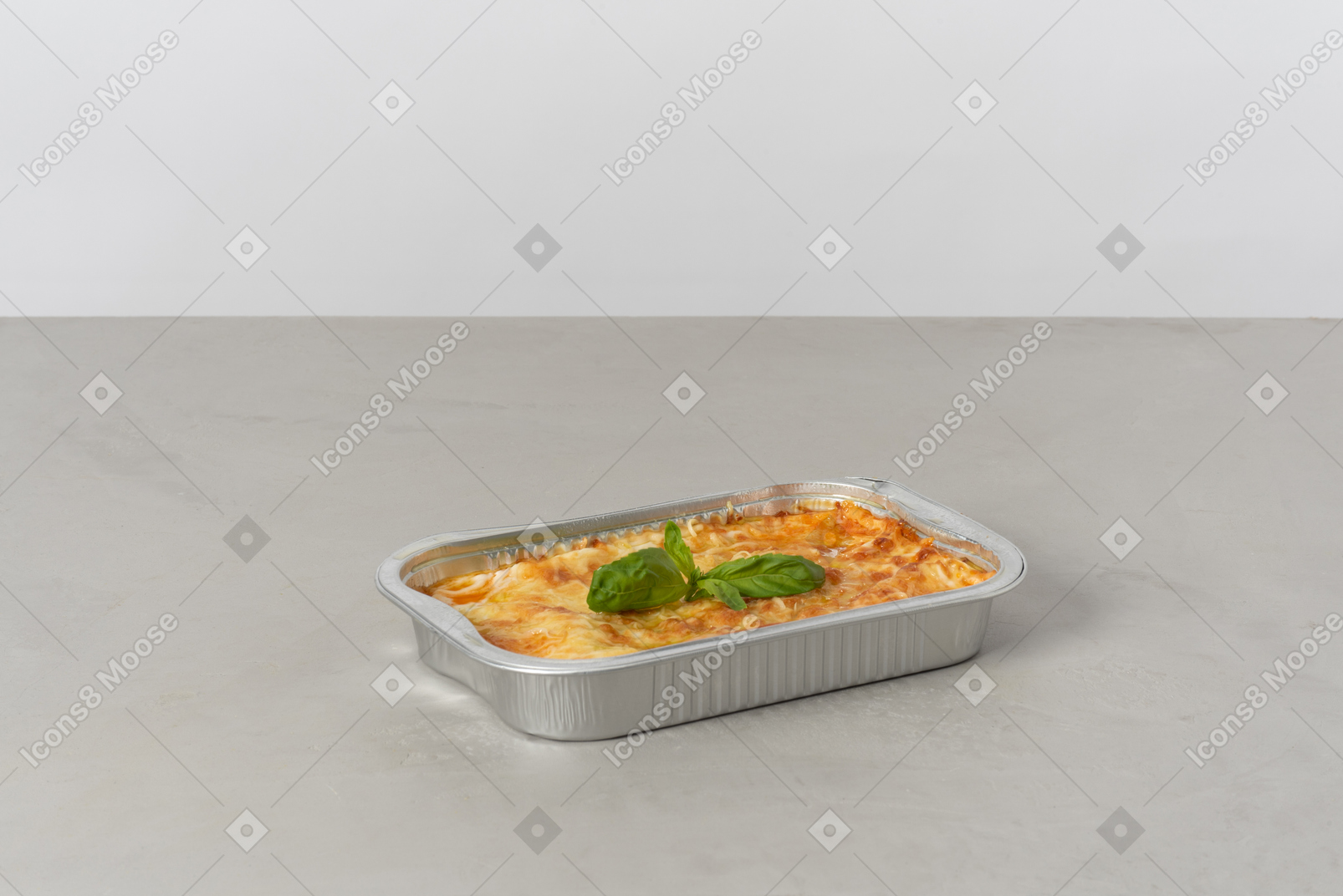 Piece of lasagna in oven pan