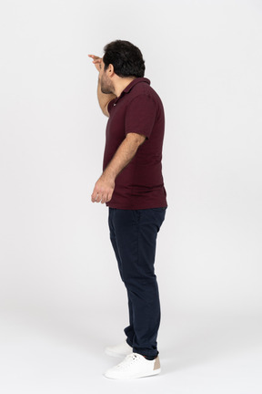 Side view of a man looking into the distance