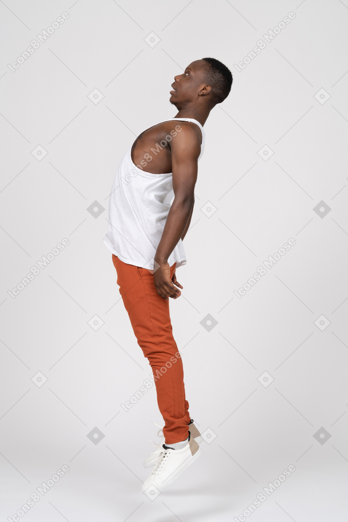 Side view of man levitating