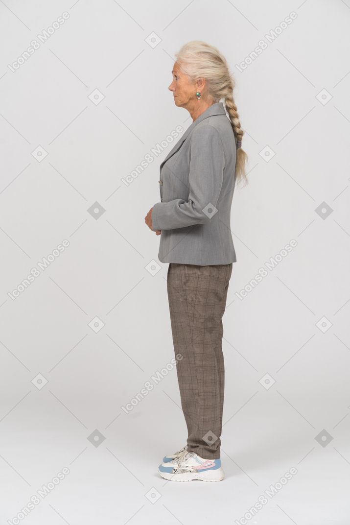 Old woman in suit posing in profile
