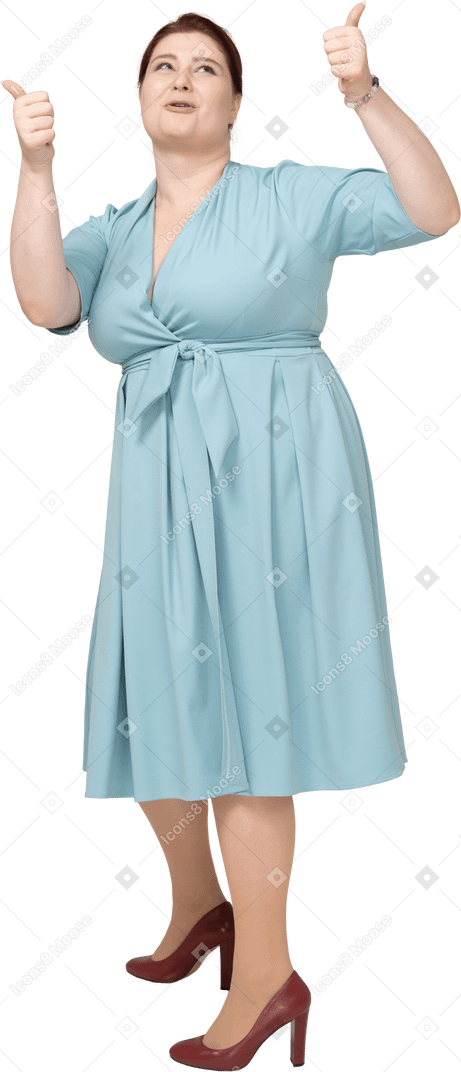 Front view of a woman in blue dress showing thumbs up