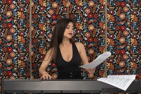 Female pianist reading musical notation