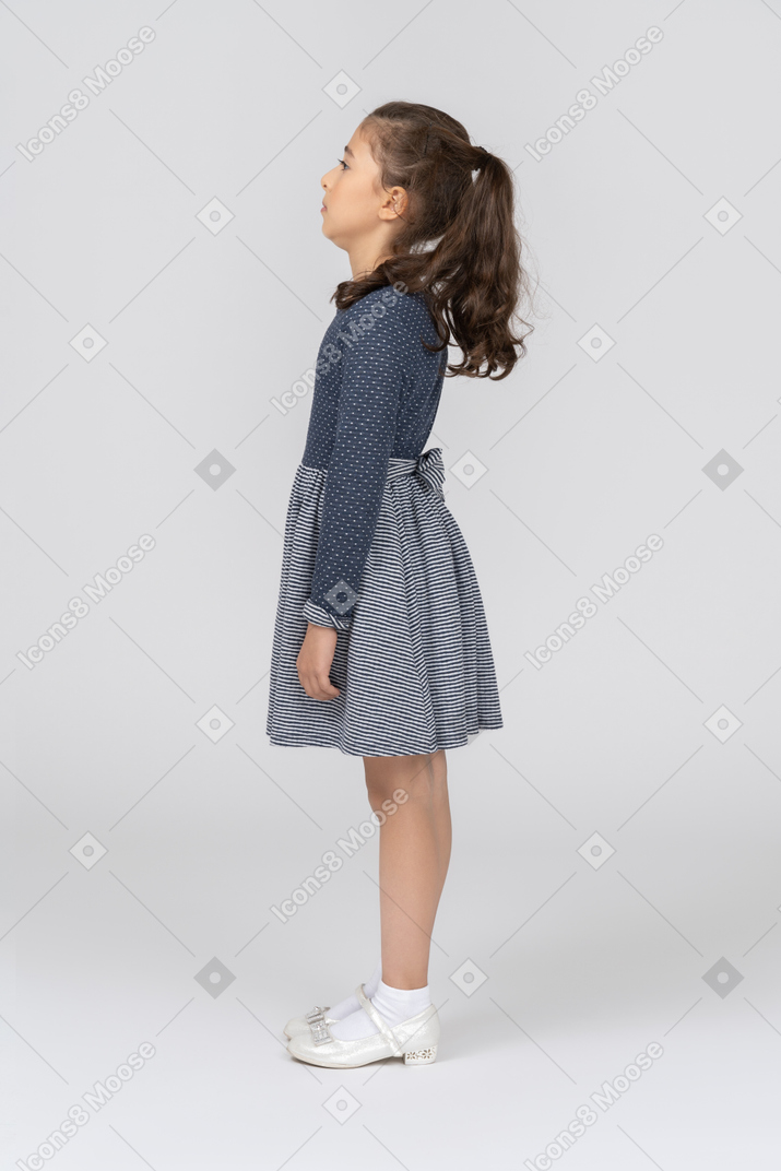 Side view of a girl with her neck retracted