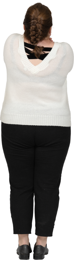 Rear view of a plus size woman in casual clothes posing