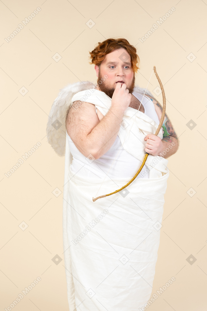 Worried big guy holding bow and arrow