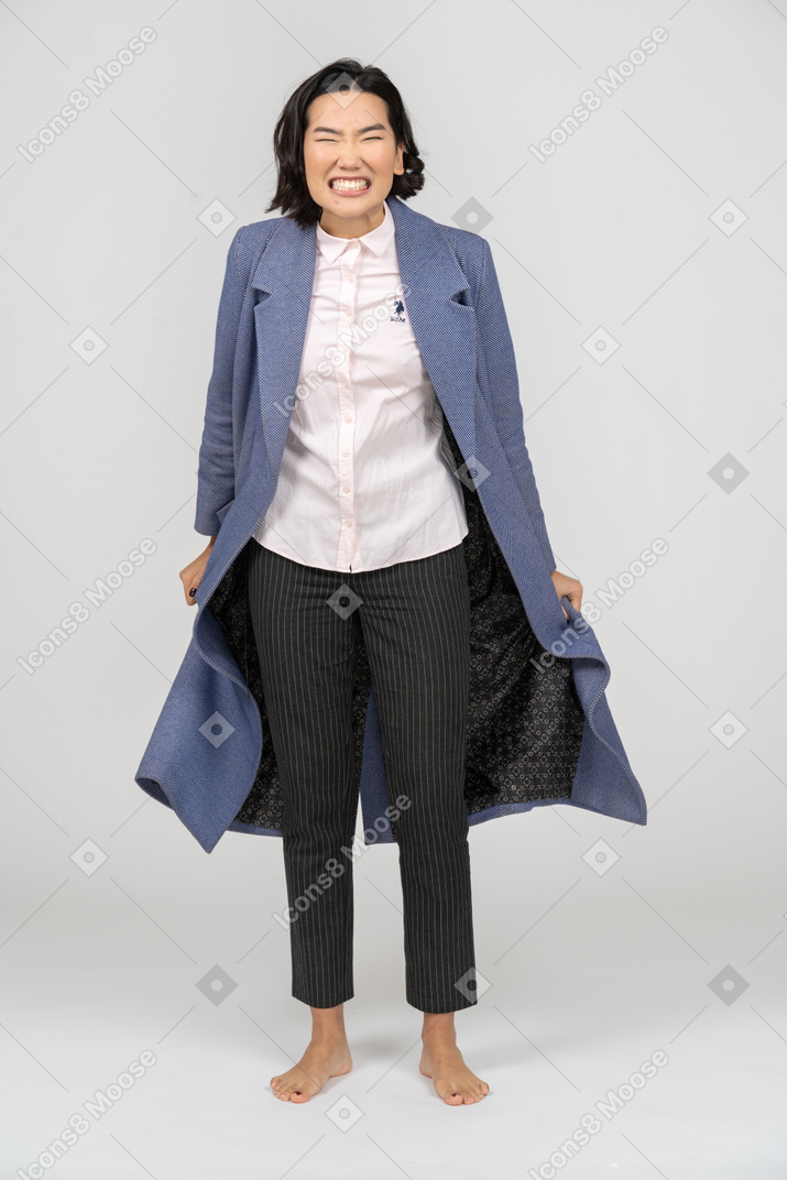 Woman in coat looking furious