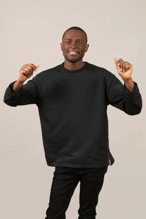 Joyful young guy dancing