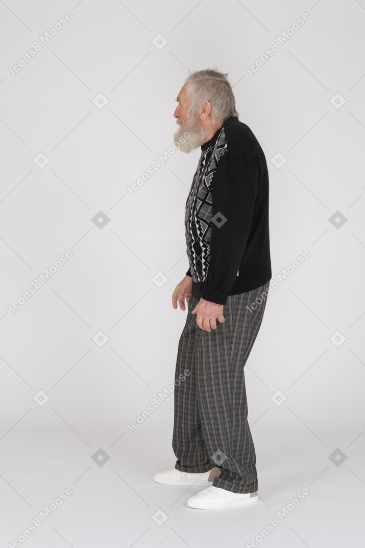 Profile view of a standing old man