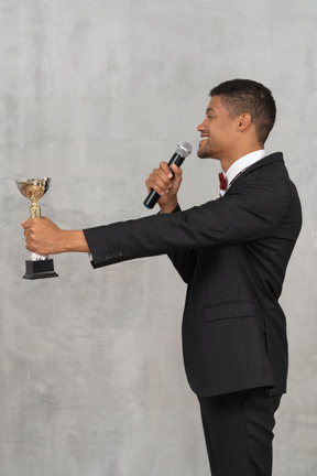 Cheerful man presenting an award