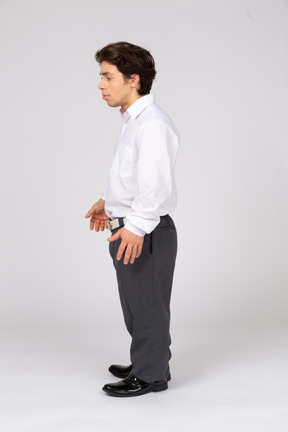 Side view of young man standing