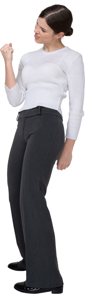Side view of a delighted young woman in office clothing