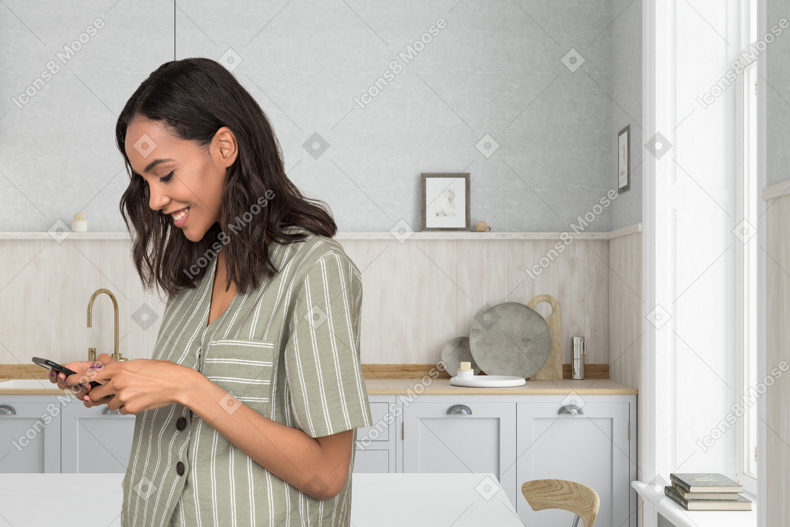 A woman standing in a kitchen looking at her phone