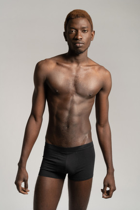 Man in black underwear standing