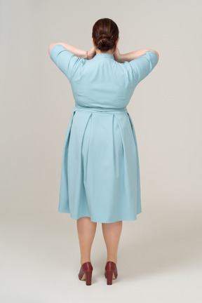 Rear view of a woman in blue dress