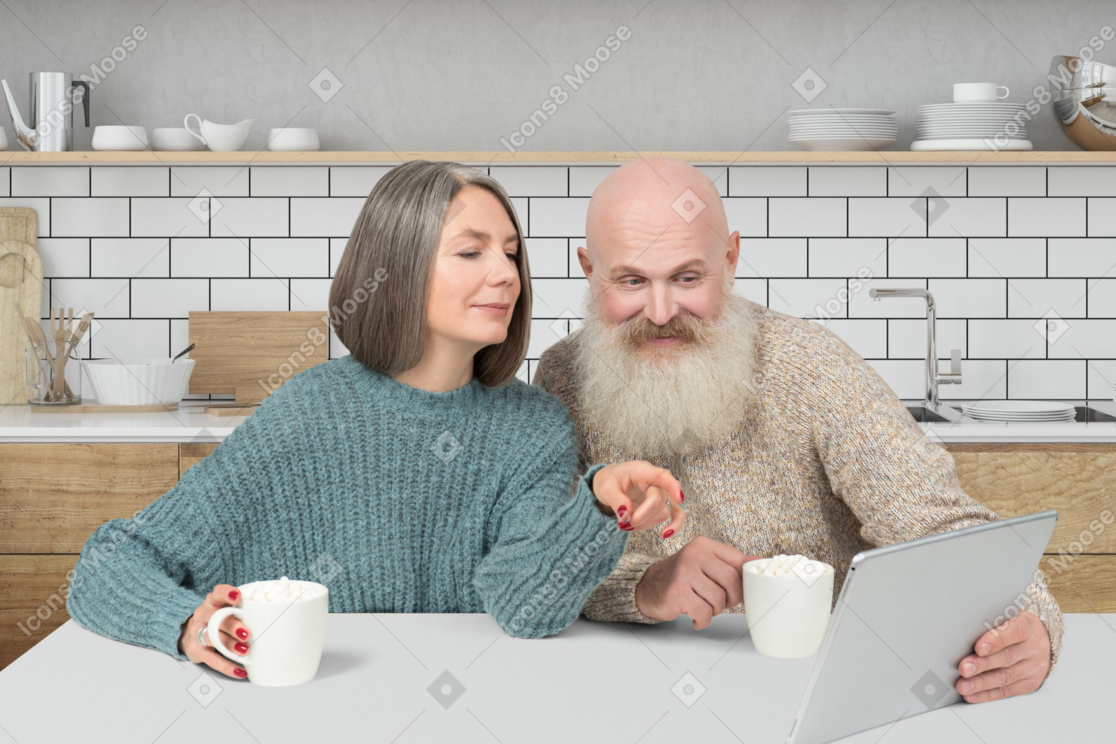 An older couple sitting at the kitchen table and looking at tablet